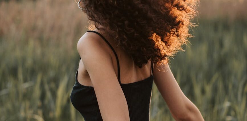 photo of woman wearing black tank top